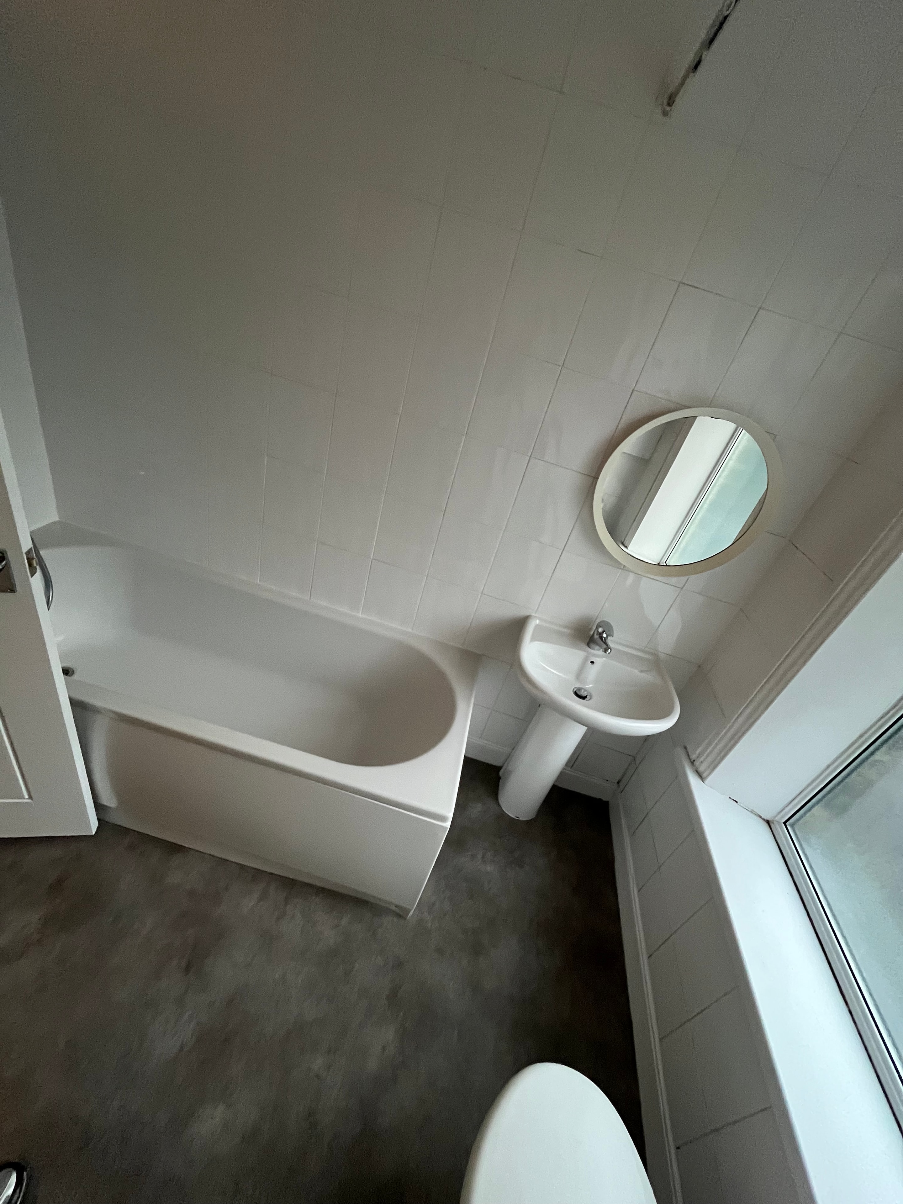 Bathroom with skylight and bathtub